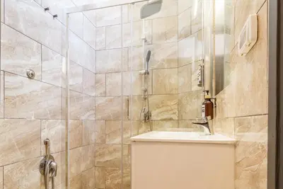 a bathroom with a sink and a shower at Cunabu Castro Pretorio in Rome