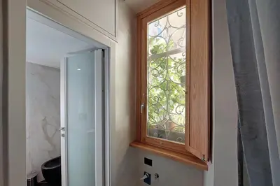 a window in a bathroom with a mirror at Loft al Pantheon by Luxury Getaways in Rome