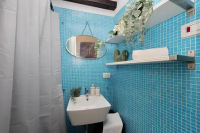 a small kitchen with a counter and a sink at Quiet nest in Campo De' Fiori in Rome