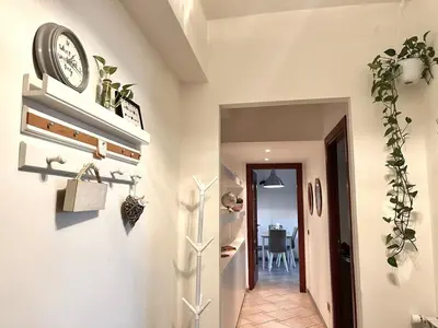 a hallway with a clock on a wall at Casa di Ross in Rome
