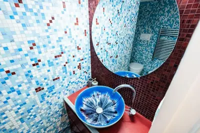 a bathroom with a blue sink and a mirror at Roma Suite Piazza Navona in Rome