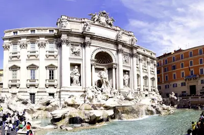 a building with a fountain in front of a building at Rome Center Attic Penthouse in Rome