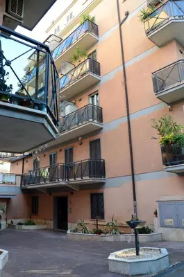 an apartment building with balconies and a courtyard at casa di Stefano in Vaticano in Rome