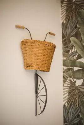 a basket on a bike hanging on a wall at Radio Suites in Rome