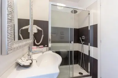 a bathroom with a sink and a shower at Apartment near the Vatican in Rome