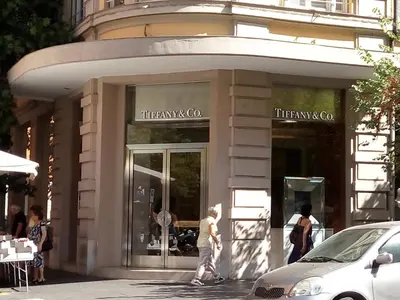 a man walking in front of a store at Apartment near the Vatican in Rome