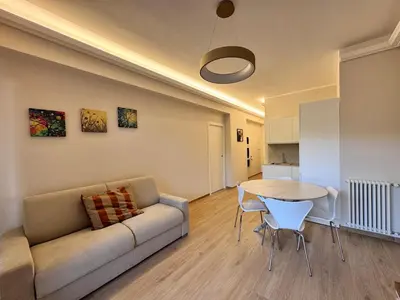 a living room with a couch and a table at Luxury Apartment Metro Cornelia in Rome