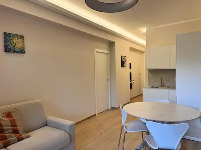 a living room with a couch and a table at Luxury Apartment Metro Cornelia in Rome