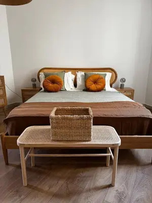 a bedroom with a bed with a bench and pumpkins at Roman Holiday Escape 2BDR Spanish steps and Trevi in Rome
