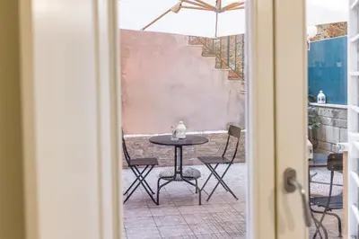 a table and chairs sitting on a patio at Rome Capital Apartments in Rome
