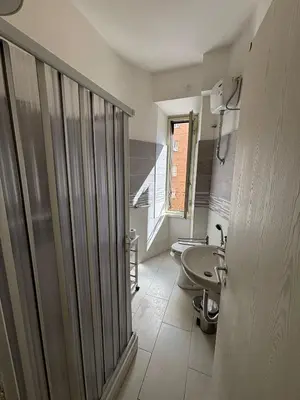 a bathroom with a sink and a toilet at Testaccio Immobiliare in Rome