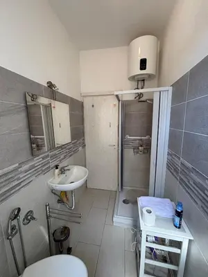 a bathroom with a toilet and a sink at Testaccio Immobiliare in Rome
