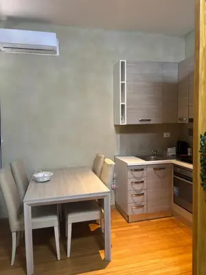 a kitchen with a table and chairs in a room at Locanda di Trastevere in Rome