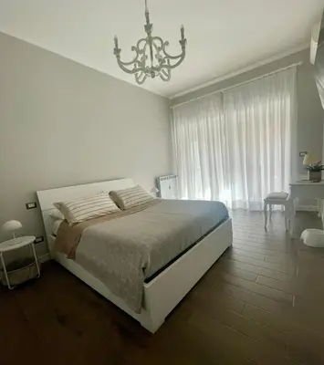 a bedroom with a bed and a tv on the wall at I Love San Pietro in Rome