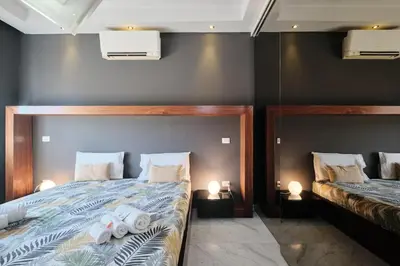a bedroom with a bed with towels on it at Vatican Apartment 4 Bedrooms AC in Rome
