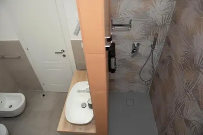 a bathroom with a white toilet and a sink at Casa Buon Vento - relax a Villa Ada in Rome