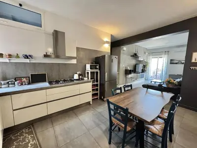 a kitchen with a wooden table and a dining room at Casa Fradella in Rome