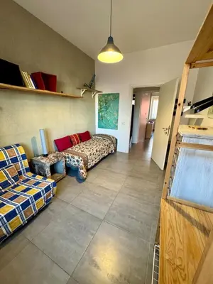 a living room with two beds and a couch at Casa Fradella in Rome