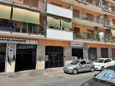 two cars parked in front of a building at Casa Fradella in Rome