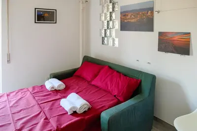 a bedroom with a bed with towels on it at Wanderlust RHome - Scopri Roma e sogna il mondo! in Rome