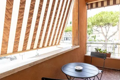 a room with a table and a window with a table and a tableearcher at Luxury Rooms near St Peter in Rome