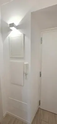 a white room with a door and a white wall at Al pozzo di Garibaldi in Rome