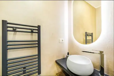 a bathroom with a sink and a mirror at Vatican City Deluxe - Suite con bagno privato - Vaticano a piedi in Rome