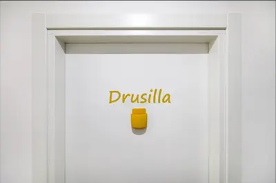 a white door with a yellow cup on it at Vatican City Deluxe - Suite con bagno privato - Vaticano a piedi in Rome