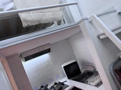 a small bathroom with a sink and a mirror at Golden Suite - un piccolo loft nel cuore di Roma in Rome