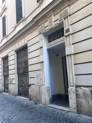 a building with a door on the side of a street at Golden Suite - un piccolo loft nel cuore di Roma in Rome