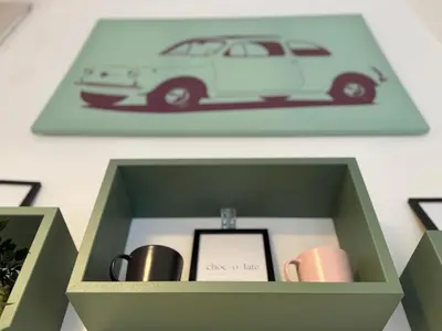 a box with a picture of a car in it at Porta Portese Luxury Suites in Rome