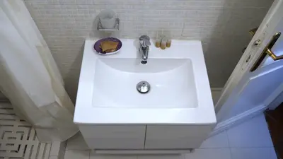 a bathroom with a white sink in a bathroom at Navona Apartment in Rome