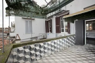an outside view of a house with a patio at 3000rome Di Parione in Rome