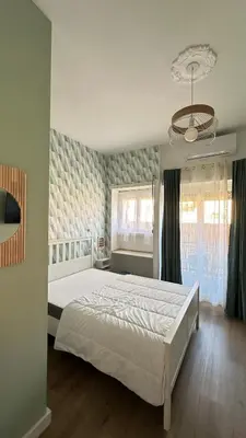 a bedroom with a large white bed in a room at Saint Peter YH in Rome