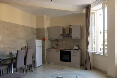 a living room with a couch and a tv at Spanish Steps Studio in Rome