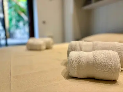 two towels sitting on the floor in a room at Vatican Walls Studio in Rome