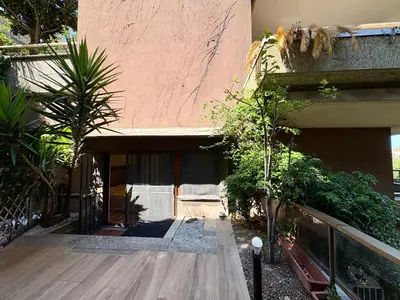 a building with a wooden walkway in front of it at Vatican Walls Studio in Rome