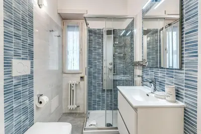 a bathroom with a toilet sink and a shower at Maison Sofia in Rome