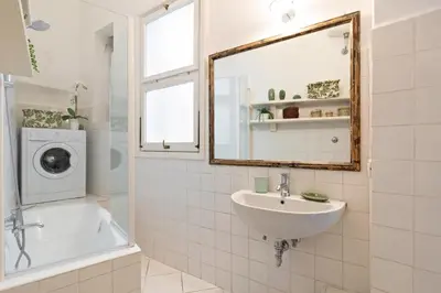 a bathroom with a sink and a washing machine at Rome as you feel - Vetrina Terrace in Rome