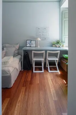 a bedroom with a bed and a desk with two chairs at Emanuela Home - VATICAN in Rome