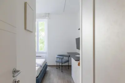 a room with a desk and a chair and a window at iFlat Sleek & Sunlit Apartment near the Vatican in Rome