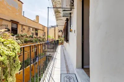 a narrow alley with plants on a building at Mazza Stay in Rome