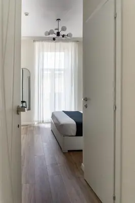 a bedroom with a bed and a window at Rome Bliss GuestHouse in Rome