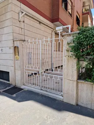 a gate on the side of a building at Ponte Lungo Guest House in Rome