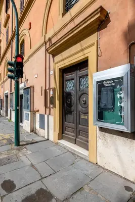 a television on the side of a building with a door at Elegante dimora - nel centro di Roma in Rome