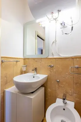 a bathroom with a sink and a toilet at Elegante dimora - nel centro di Roma in Rome
