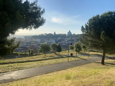 a road in a park with a view of a city at Trinita' dei Monti, night check-in also available in Rome