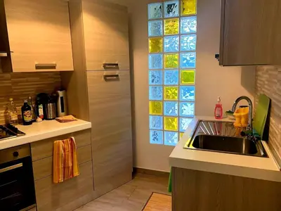 a kitchen with a sink and a window at La Casa dei Melograni in Rome