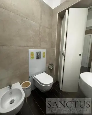 a bathroom with a white toilet and a sink at Sanctus Michael Archangelus in Rome