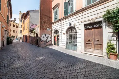 an empty street in an old city with buildings at Number Five Apartment in Trastevere in Rome
